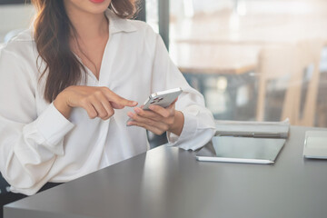 Marketing, Financial, Accounting, Planning, businesswomen uses a mobile phone to contact a customer to inform her of the company is business partnership.