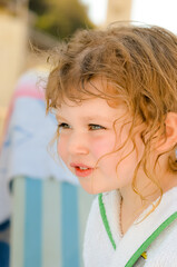 Little girl wiping herself after her bath