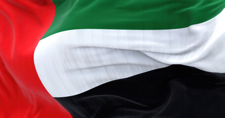 Close-up view of the United Arab Emirates national flag waving in the wind
