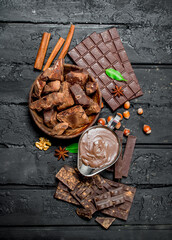 Chocolate background. Various assortment of chocolate with paste.