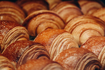 Close-up of fresh and beautiful pain au chocolats in a bakery showcase.