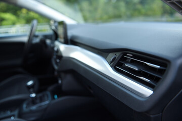 Fototapeta premium Close-up of the dashboard, adjustment of the blower, air conditioner. Elements of air conditioning and heating in the car. 