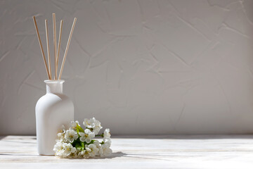 Aromatic reed diffuser and cherry flowers