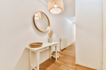 Stylish hallway with table and mirror