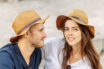 Happy Portrait of a happy young couple. A couple in love smiles and dreams. Valentine's Day. cheerful young couple in casual clothes traveling the world. romance and adventure. Tourists in love