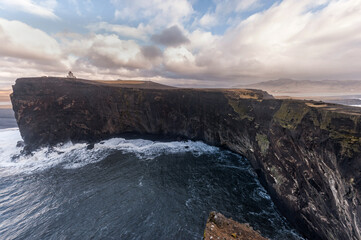 Dyrholaey Area in Iceland. Close to Black Sand Beach. Sunrise. Lighthouse in Background.