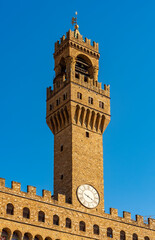 Fototapeta na wymiar Tower of Palazzo Vecchio (Old palace) on Signoria square in Florence, Italy