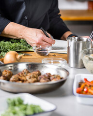 Obraz na płótnie Canvas Chef preparing food in kitchen