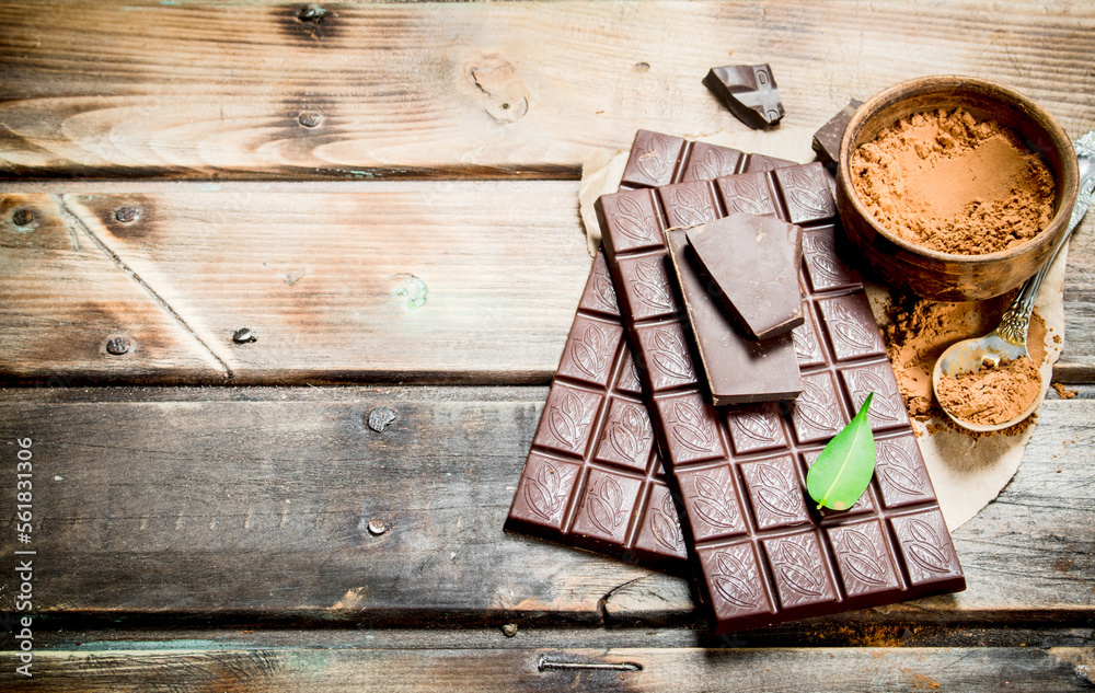 Wall mural Chocolate bars with cocoa powder.