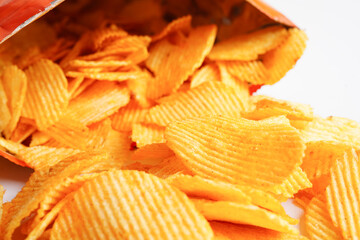 Potato chips in open bag, delicious BBQ seasoning spicy for crips, thin slice deep fried snack fast food.