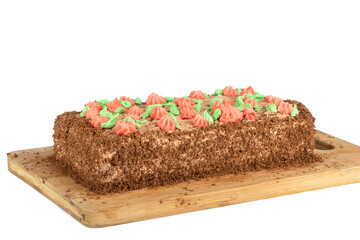 Sponge cake decorated with multi-colored buttercream flowers. Homemade cake.