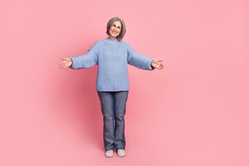 Full length photo of retired positive cheerful lady wearing stylish casual outfit friendly smile want hug you isolated on pink color background