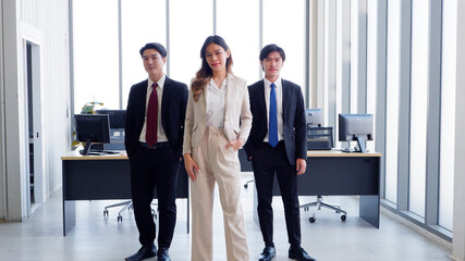 Female employee and colleague smiling inside the office business idea.