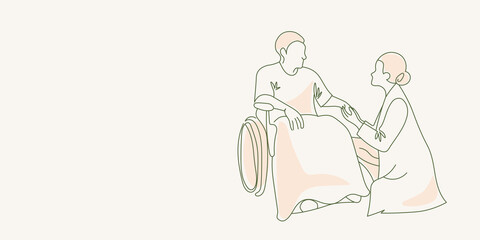 doctor talking to a patient in a wheelchair