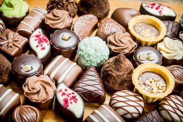 Chocolate candies with nuts and various fillings.