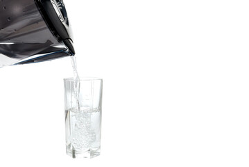 Filter for purification of drinking water from impurities on a white background with a glass...