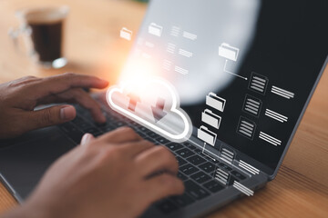 Man employs cloud computing in business information networking. Online digital data storage and connection service for download or upload via cyberspace or server