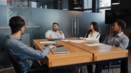 Office meeting multiracial employees work together teamwork discuss project business team multiethnic IT developers diverse people at company workplace working discussing marketing strategy ideas