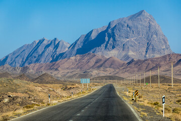 Empty straight road in mountainous area of Yazd Province, Iran