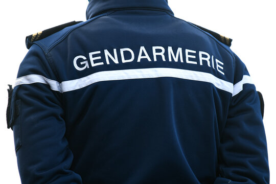A policeman (gendarme from "gendarmerie") from the back with uniform ensuring security in Paris, France.
