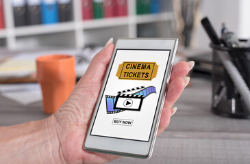 Online cinema tickets booking concept on a smartphone