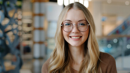 Head shot happy portrait caucasian girl in glasses young woman satisfied with ophthalmology...