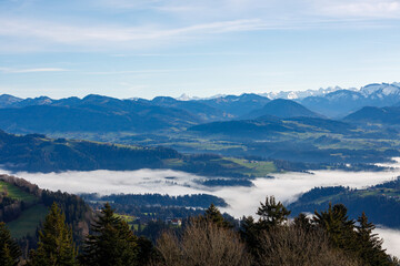 Fototapeta na wymiar Austrian mountains landscape with fog, blue sky