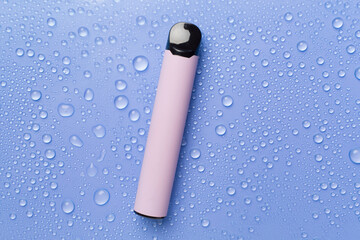 Disposable electronic cigarette on color background, top view
