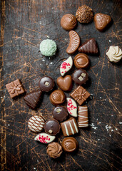 Chocolate sweets with nuts and various fillings.