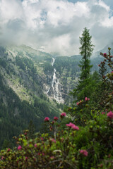 huge waterfall in the Reisseck group of the high tauern mountain range in carinthia during a beautiful summer hike.