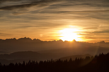 Sunset seen from Lorenziberg over the carithian valleys towards the karawanken mountain range on the austrian and Slovenian border.