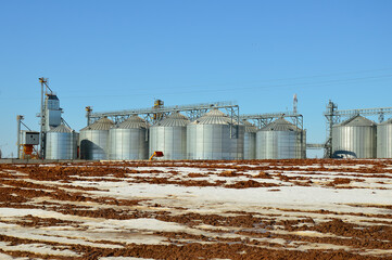 Grain storage elevator . Silver silos at an agro-processing and manufacturing enterprise for...