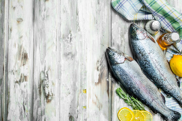 Raw fish salmon with rosemary and lemon.