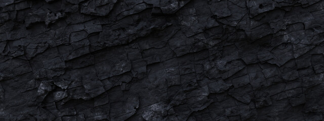 Black grunge rock panorama banner background. Dark gray fractured stone texture. Mountain cracks close-up backdrop with space for text and design