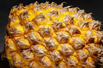 Fresh pineapple skin, close-up, natural texture, bright, natural, exotic and warm colours