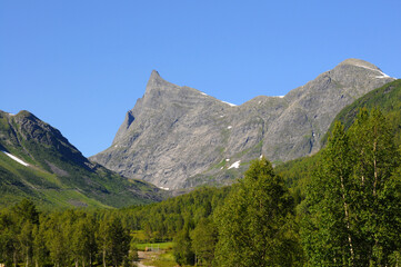 Hornindalsrokken in the summer with blue sky behind