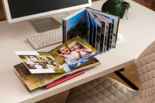 Family photos archive saved in brightly designed photo book, bright summer memories placed in the photobook
