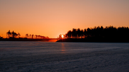 Fototapeta premium sunrise over a frozen lake
