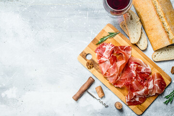 Traditional Spanish ham with ciabatta and red wine.