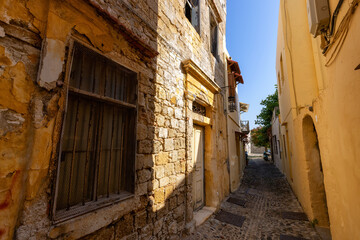 Fototapeta na wymiar Streets and Residential Homes in the historic Old Town of Rhodes, Greece. Sunny Morning.