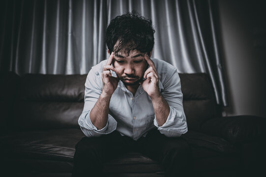 Asian Handsome Man Stress From Work Overload,Tired Male Come Back Home After A Lot Of Work From Company,risk Of Depression