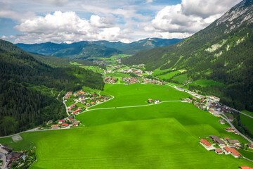 Austrian glacier water sea mountains lake landscape nature drone shot clouds sky green village alaska norway fjord blue forest 