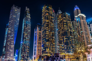 Dubai Marina bay cityscape skyscrapers UAE business district tower modern architecture long exposure lights night sky 
