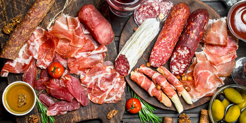 Antipasto background. Assortment of meat snacks on the Board .