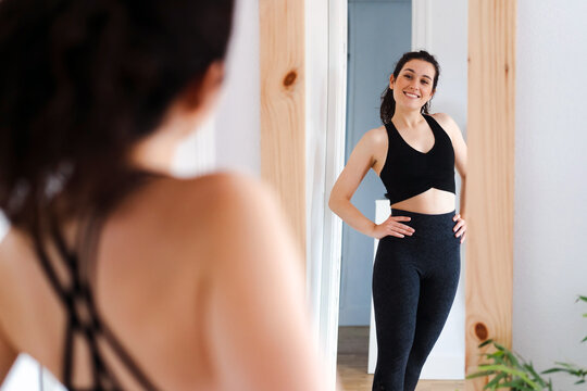 Woman proud of her body after training