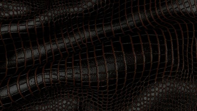 Background of crocodile leather in motion. Backdrop of the reptile skin.