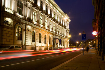 A street scene at night in Budapest, Hungary, with light trails
