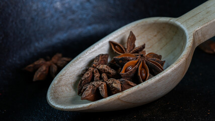 Anise  inside wooden spoon close up