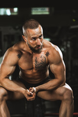 Fototapeta na wymiar Bodybuilder Getting Ready To Weightlifting At The Gym