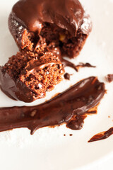 Chocolate muffins on a white plate, on a white background. Fresh chocolate.